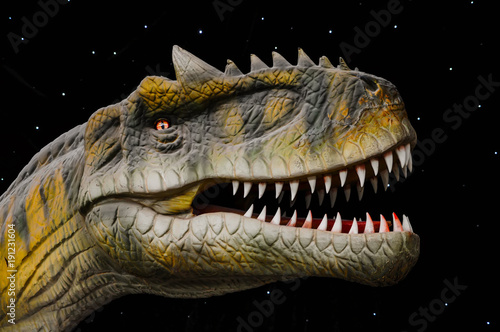 The head of the dinosaur T-Rex with sharp teeth