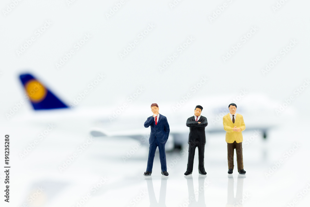 Miniature business people : businesses team with plane. Image use for background travel, business trip travel advisory agency of transportation concept. Miniature business people : businesses team with plane. Image use for background travel, business trip travel advisory agency of transportation concept.