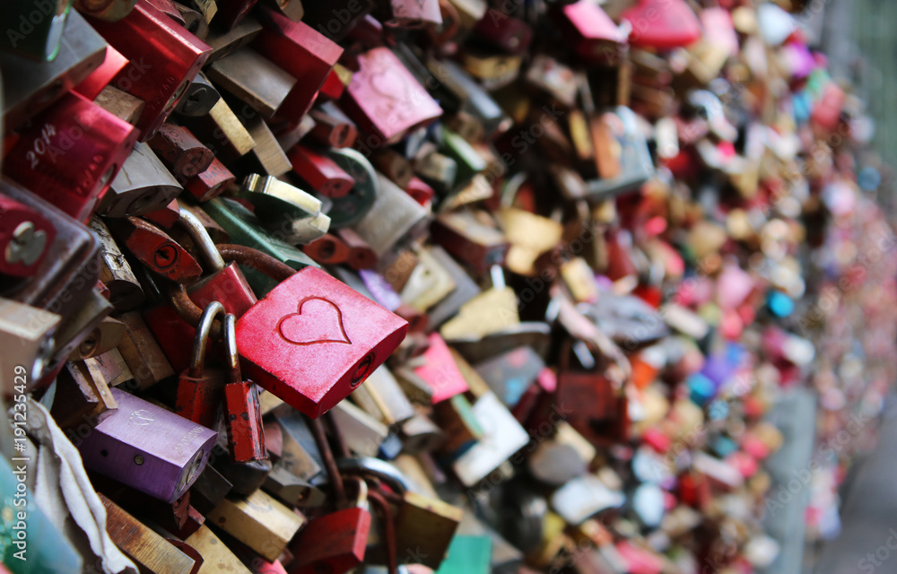 Valentine's Day - many padlocks on a bridge - red padlock with heart in the front