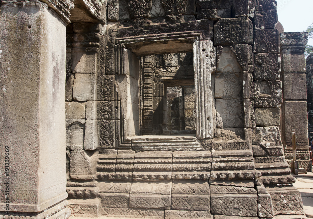 Carved Stone images on Bayon Temple ruins, 12th century, in Angkor Wat, Siem Reap, Cambodia