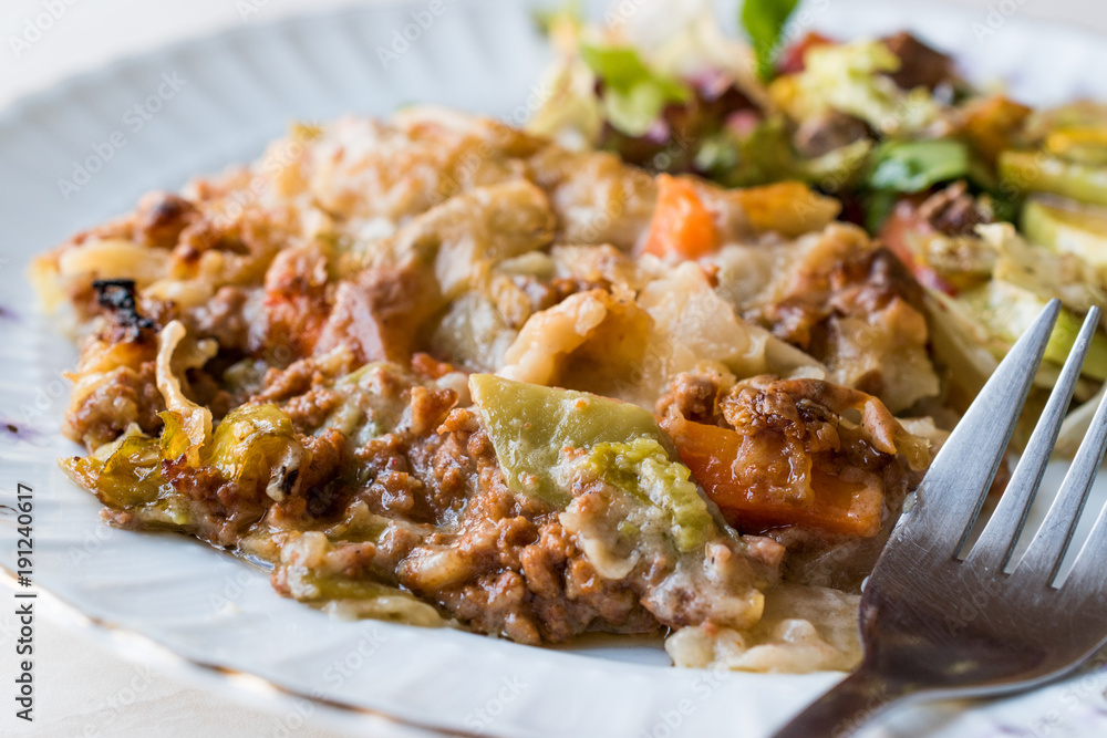 Naklejka premium Vetegables Gratin with Minced Meat, Cheese and served with Salad