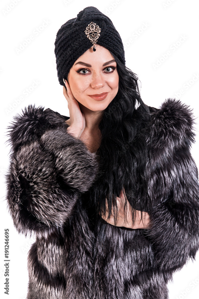 Pretty young woman in a black fur coat and turban Pretty young woman in a black fur coat and turban