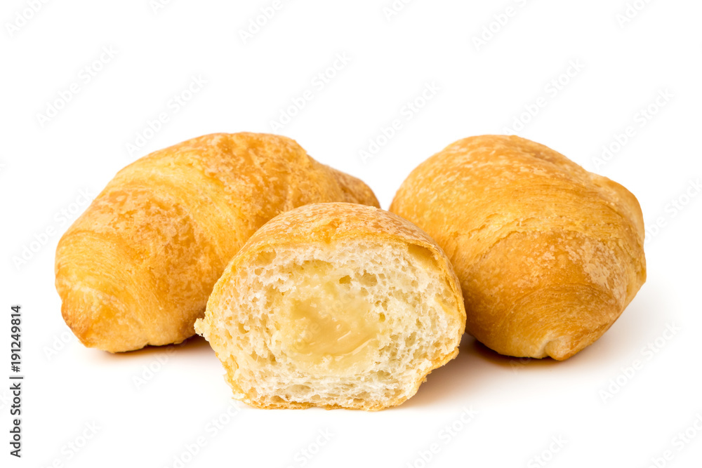 Croissants and half on a white