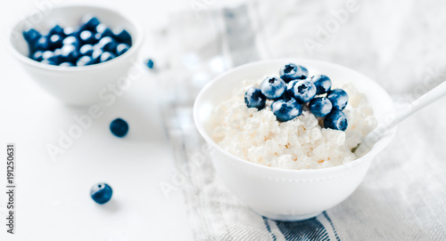 Принти на полотні Cottage cheese with blueberries in a bowl on a table
