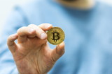 Man holding bitcoin in the hand