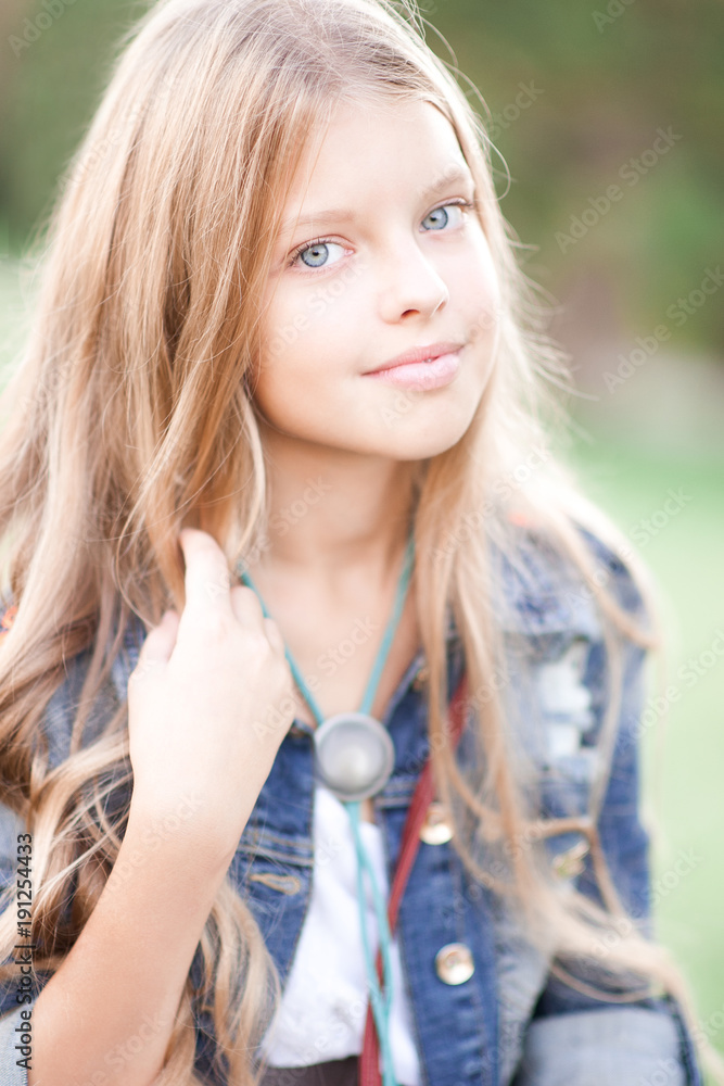 Smiling Blonde Teenage Girl 14 15 Year Old With Long Hair Posing Outdoors Looking At Camera 