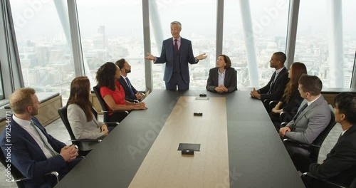 4k, A large multi ethic group of business people celebrate their success and clap in slow motion.