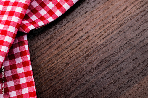 Napkin on the wooden background with copy space. Top view