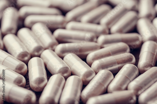 Medical pills and capsules background, group of drugs, selective focus