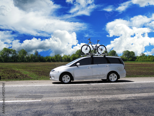 Car with the bycycle on the highway © Dmitry Perov