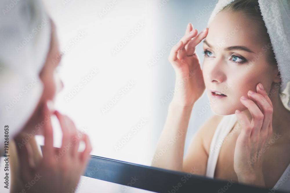 face of young beautiful healthy woman and reflection in the mirror face of young beautiful healthy woman and reflection in the mirror
