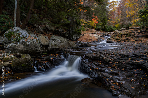 Fototapeta Naklejka Na Ścianę i Meble -  Scenic Small Roadside Waterfall in Autumn Colors - Pennsylvania