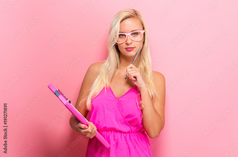 Office woman with a clipboard on a solid background Office woman with a clipboard on a solid background