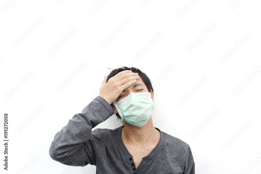 Men with migraine headache fever and dust mask. Men with migraine headache fever and dust mask.