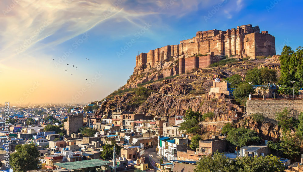 Mehrangarh Fort at sunset with view of Jodhpur cityscape.