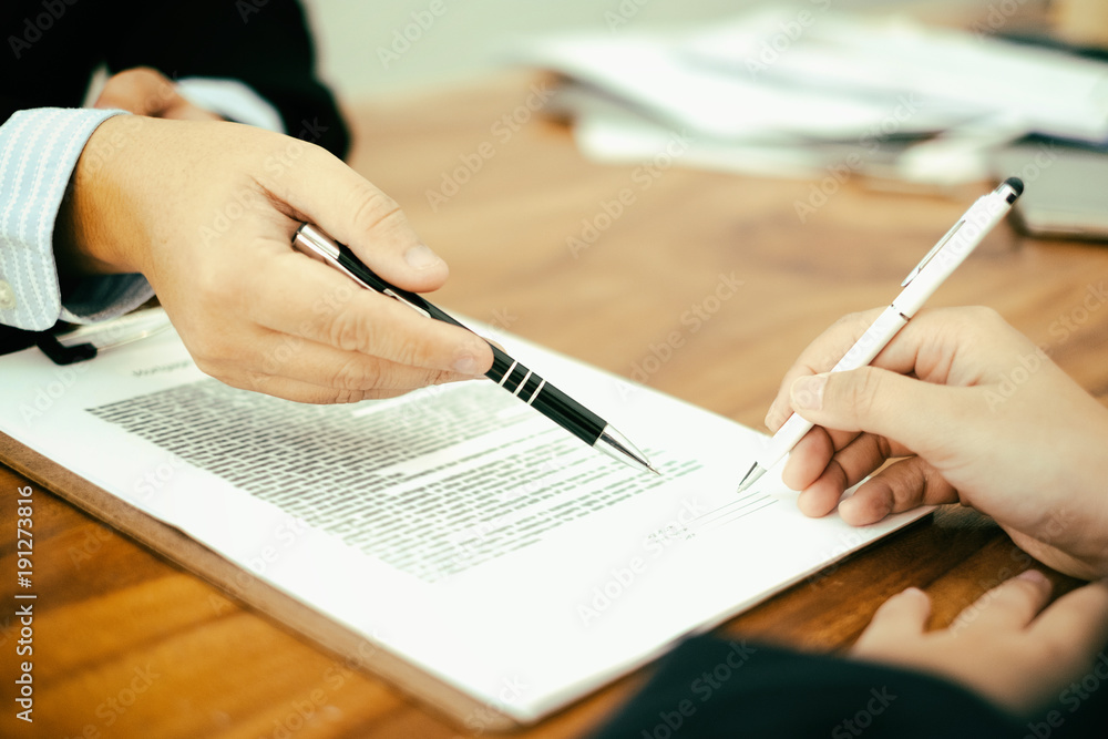 businesspeople working and discussing new plan project in office and putting signature on document, agreement concept businesspeople working and discussing new plan project in office and putting signature on document, agreement concept