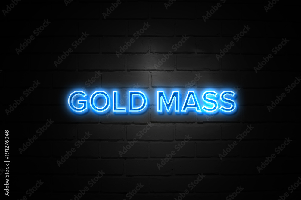 Gold Mass neon Sign on brickwall Gold Mass neon Sign on brickwall