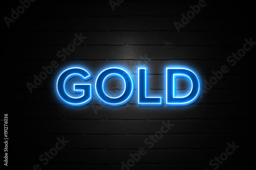 Gold neon Sign on brickwall