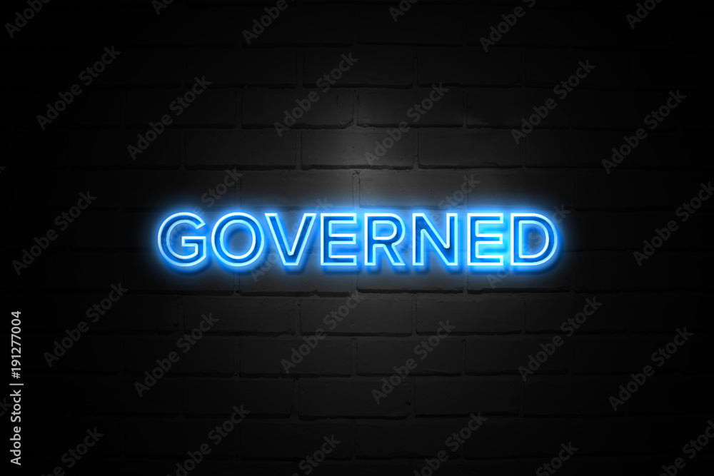 Governed neon Sign on brickwall