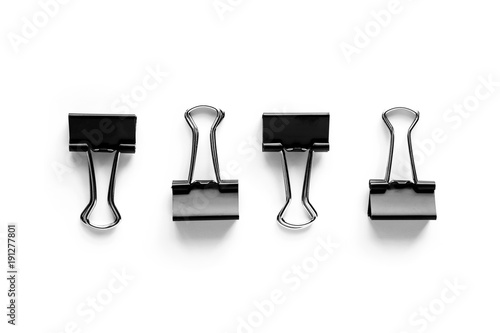 Binder clips on white backg...