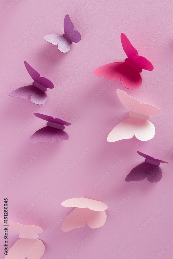 Paper butterflies on a pink background. Love and Valentine's day concept. Top view Paper butterflies on a pink background. Love and Valentine's day concept. Top view