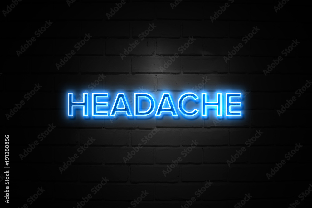 Headache neon Sign on brickwall