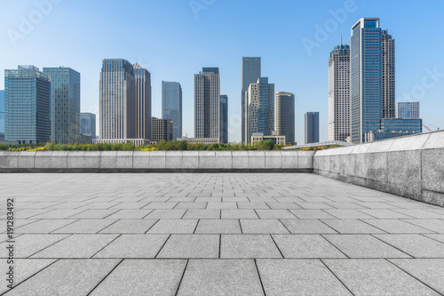 empty brick floor with cityscape and skyline.