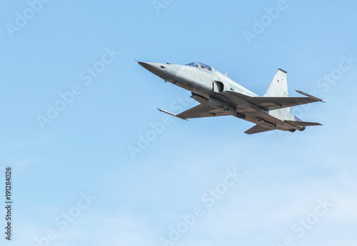 fighter jet military aircrafts flying with high speed on blue sky background