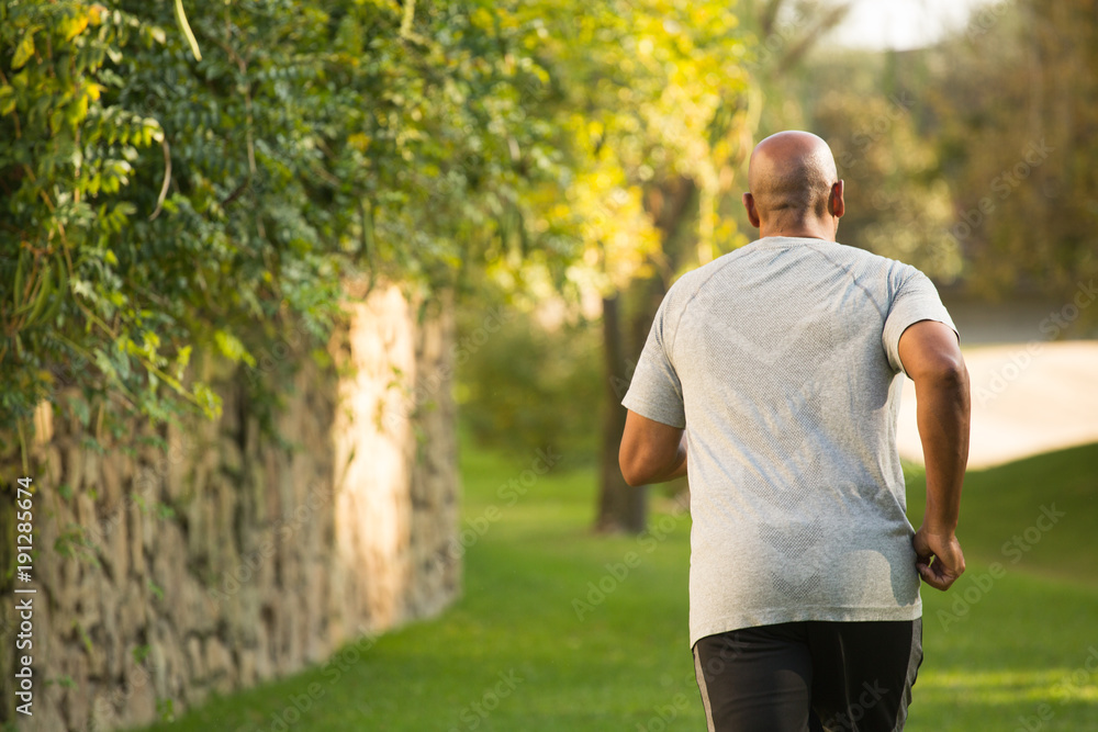 Fit African American man running. Fit African American man running.