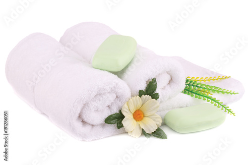 Towel, soaps and flowers