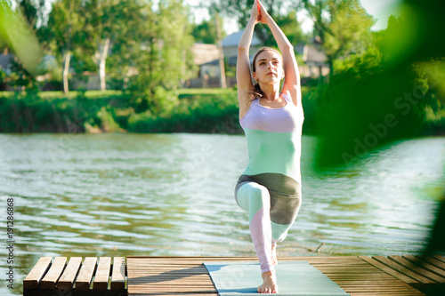 Young slim yoga woman making beautiful asana exercises. Healthy lifestyle. Stretching.