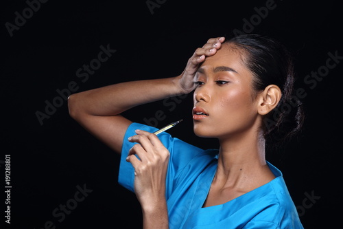 Doctor Nurse in white blue shirt with syringe