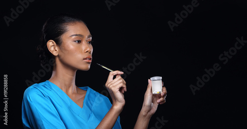 Doctor Nurse in white blue shirt with syringe