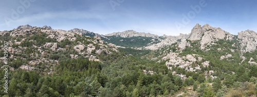 Panoramic views of La Pedriza from the Giner de los Rios refuge, in Guadarrama Mountains, Madrid, Spain. It can be seen Las Torres (The Towers), Las Buitreras (Vulture) and El Pajaro (The Bird) peaks photo