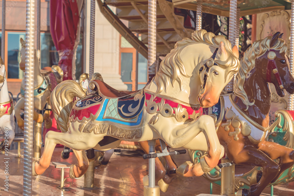 Horses on a carnival Merry-Go-Round. toned