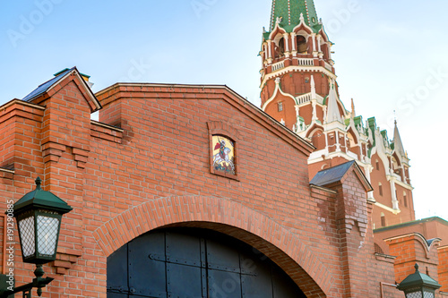 Photography fragment of moscow kremlin wall with Trinity tower and metal gates