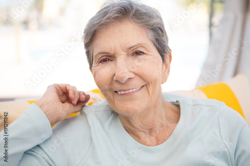 Portrait of a mature elderly woman smiling.