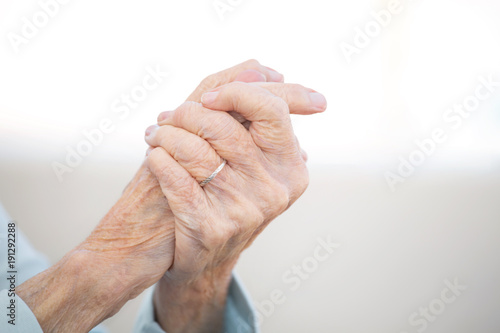 Portrait of a mature elderly woman with arthritis.