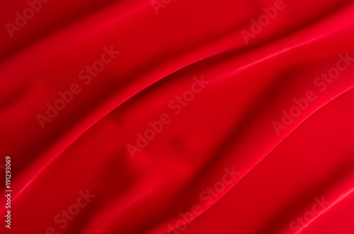 Red silk wavy background. Passion backdrop for Valentines day.