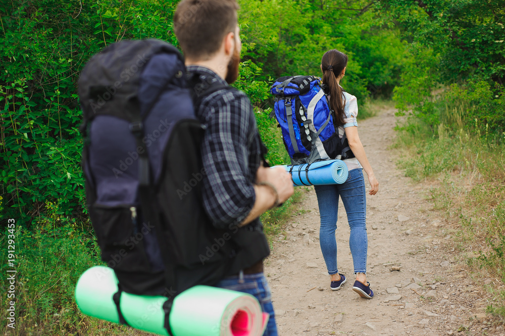 Fototapeta premium Two Young Tourists With Backpacks