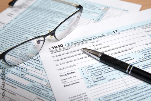 USA tax form 1040 with eyeglasses and Pen