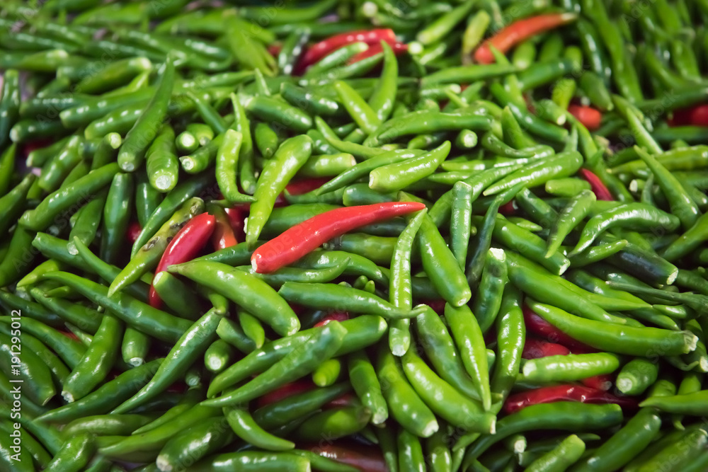 Red and green Bird's Eye Chilli stack together for several seeds. Red and green Bird's Eye Chilli stack together for several seeds.