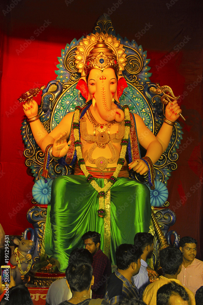 Ganapati idol with devotee during Ganapati festival