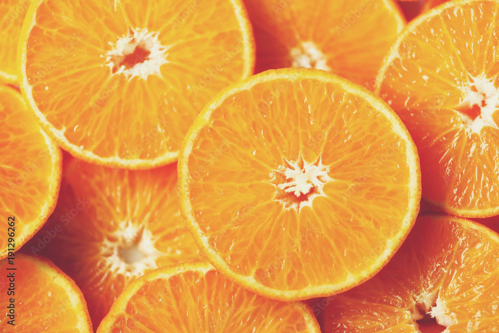 Fresh sliced orange fruit texture. Macro, top view, copy space. Food frame. Juicy oranges background Fresh sliced orange fruit texture. Macro, top view, copy space. Food frame. Juicy oranges background