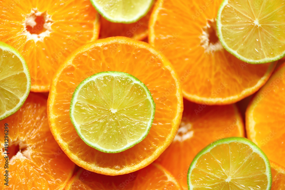 Fresh sliced orange fruit texture. Macro, top view, copy space. Food frame. Juicy oranges and lime background Fresh sliced orange fruit texture. Macro, top view, copy space. Food frame. Juicy oranges and lime background
