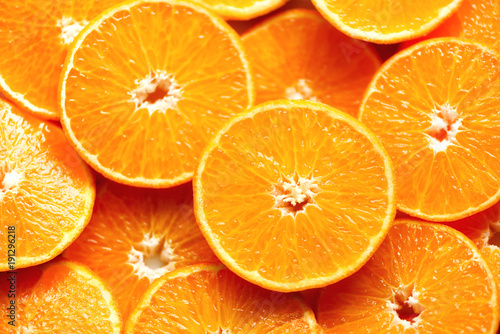 Fresh sliced orange fruit texture. Macro, top view, copy space. Food frame. Juicy oranges background