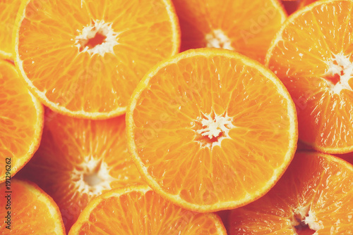 Fresh sliced orange fruit texture. Macro  top view  copy space. Food frame. Juicy oranges background