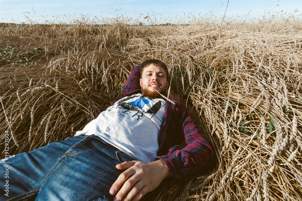 man on a background of landscape fields, wheat man on a background of landscape fields, wheat