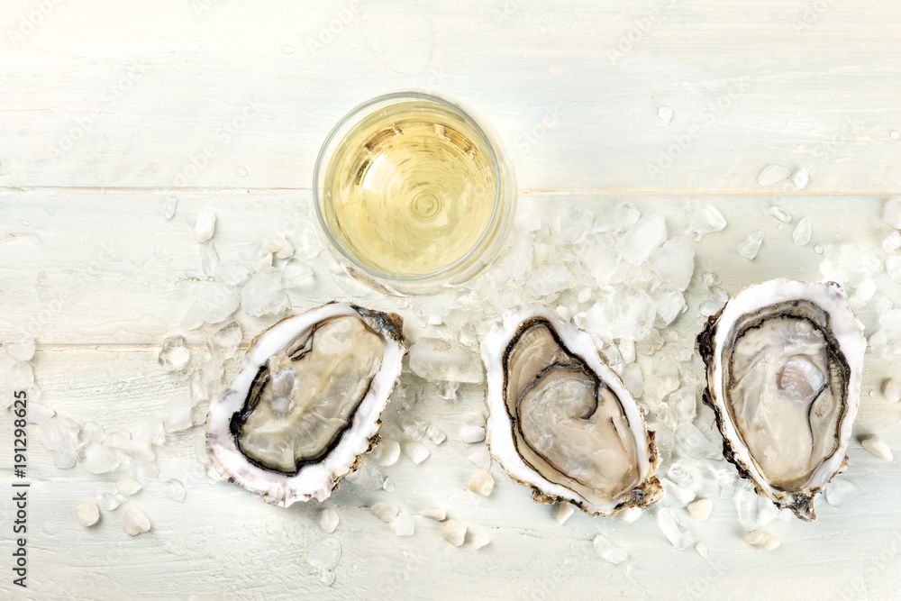 Overhead photo of oysters with wine and copy space Overhead photo of oysters with wine and copy space