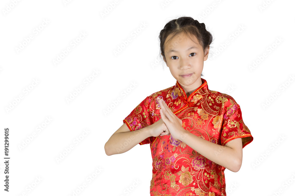 Asian girl wearing red Chinese suit on white background during traditional chinese new year festival,girl with congratulation gesture Asian girl wearing red Chinese suit on white background during traditional chinese new year festival,girl with congratulation gesture